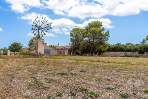 Finca requiring renovation with an old windmill between Colonia St. Jordi and Campos